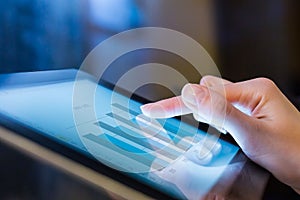 Woman holding digital tablet, closeup