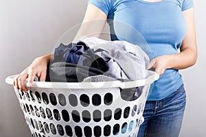 Woman Holding Dirty Laundry