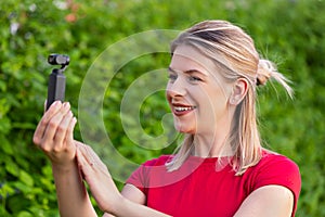 Woman holding DJI Osmo Camera