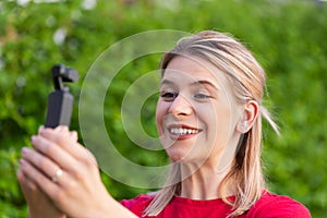 Woman holding DJI Osmo Camera