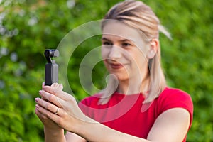 Woman holding DJI Osmo Camera