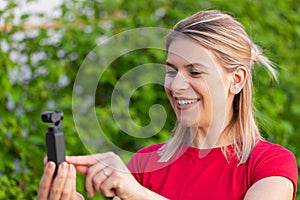 Woman holding DJI Osmo Camera