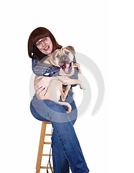 Woman holding dog.