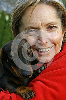 Woman holding a dog