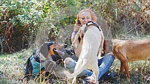 Woman holding a dog in her arms