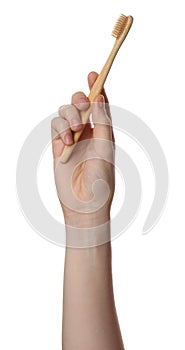 Woman holding eco friendly bamboo toothbrush on white background, closeup. Conscious consumption