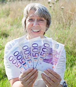 Woman holding 2500 euro
