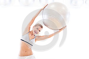 Woman holding exercise ball