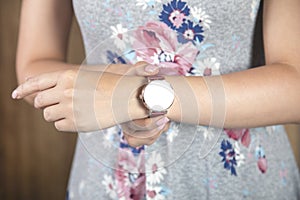 The woman holding fashion watch