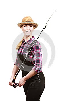 Woman holding fishing rod looking at float