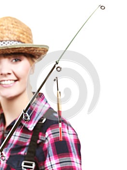 Woman holding fishing rod looking at float