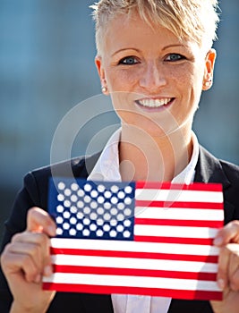 Woman holding flag of the USA