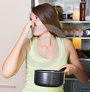 Woman holding foul food
