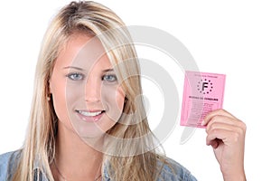 Woman holding French driving licence