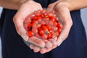 Woman holding fresh goji berries, closeup