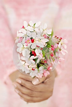 Woman holding fresh spring flowers