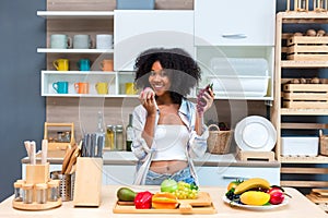 Woman holding fruit in kitchen room. woman on a diet, a woman vegetarian prepares a eat fruit