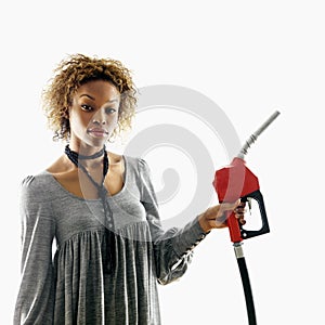 Woman holding gas nozzle