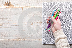 Woman holding gel pens, Adult coloring books, new stress relieving trend