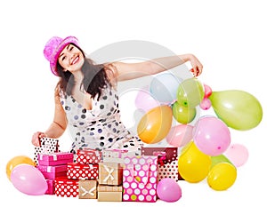 Woman holding gift box at birthday party.