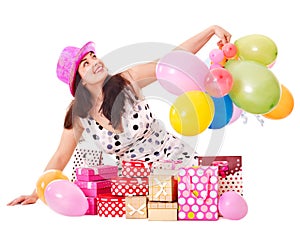 Woman holding gift box at birthday party.