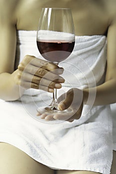 Woman holding a glass of red wine