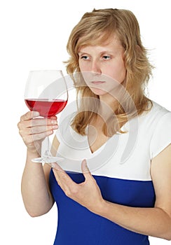 Woman holding glass of red wine on white