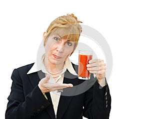 Woman holding glass of tomato juice
