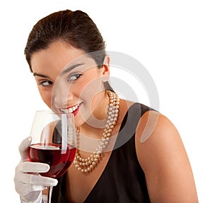 Woman Holding Glass of Wine Looking Sideways