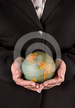 Woman holding globe in both hands