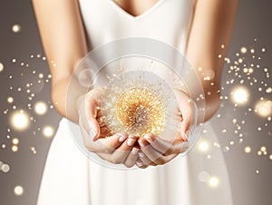 Woman holding glowing ball in hands on sparkle backdrop. New Year, Christmas, festive, fairy tale