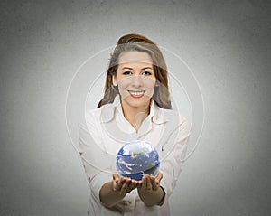Woman holding glowing earth globe