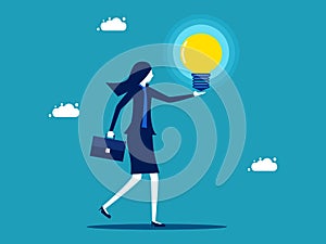 woman holding a glowing light bulb. knowledge and creativity. business concept