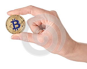 Woman holding golden bitcoin on white background