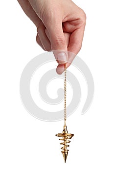 Woman holding golden pendulum with chain on white background, closeup. Hypnosis session