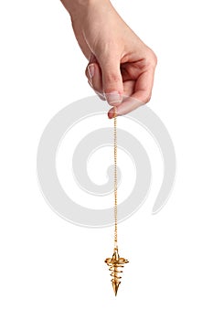 Woman holding golden pendulum with chain on white background. Hypnosis session