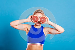 Woman holding grapefruit citrus fruit in hands