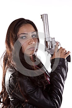 Woman holding gun looking back