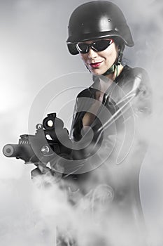 woman holding gun with smoke