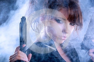 woman holding gun with smoke