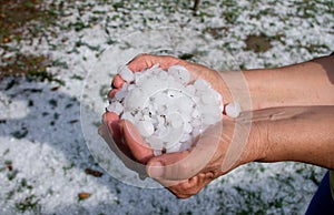 Woman holding hail stones in hands