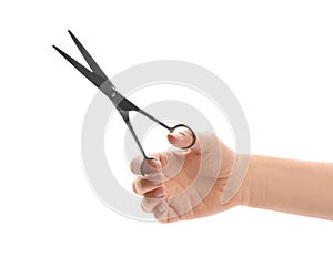 Woman holding hairdresser`s scissors, closeup