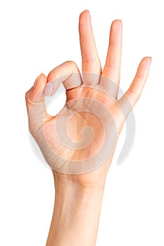 Woman holding hand in gesture of okay or letter O. Sign of success or luck