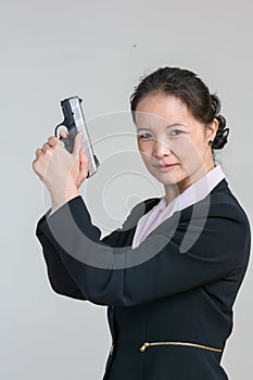 Woman holding a hand gun