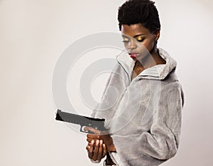 Woman holding in hand a guns