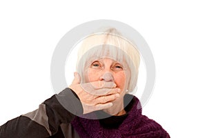 Woman holding hand over her mouth