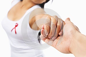 Woman holding hand to support AIDS cause