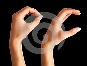 Woman holding hands in gesture of okay or letter O. Sign of success or luck
