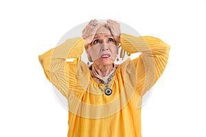 Woman holding head in desperation.