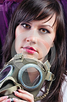 Woman holding her gasmask tight